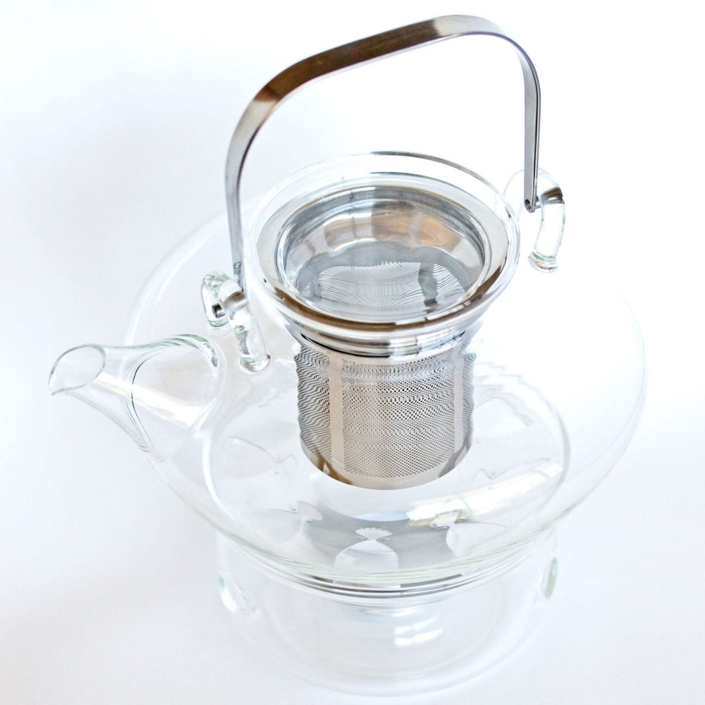 
                  
                    Clear Glass Teapot with Warmer.
                  
                